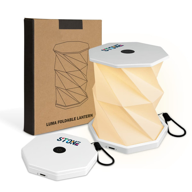 A foldable lantern in white with a hexagonal shape, presented with a brown box and featuring a logo.