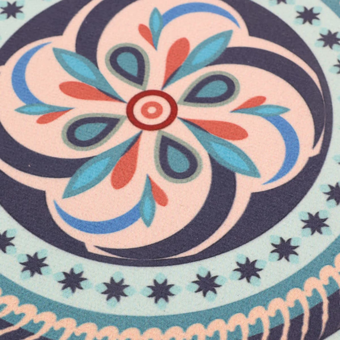 A round trivet featuring a floral design in turquoise, pink, and navy blue, with decorative patterns.
