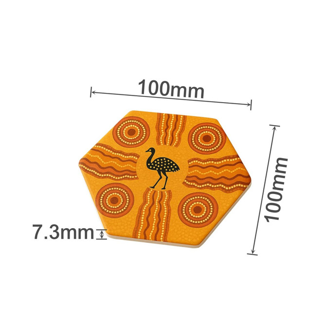 A hexagon ceramic coaster in orange and yellow featuring Aboriginal designs and a black bird silhouette.
