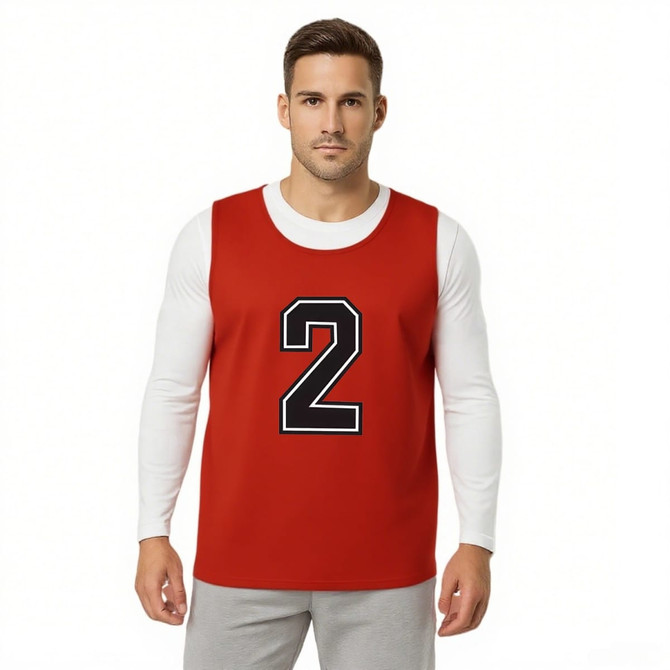 A reversible training bib in red with a large black number 2, worn over a white long-sleeve shirt.