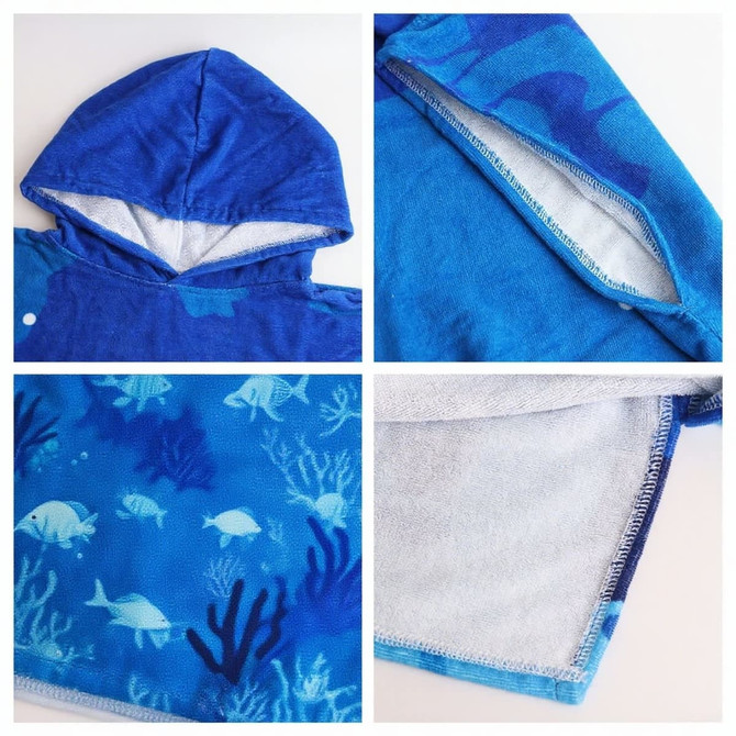 A blue cotton surf poncho towel with a hood and dolphin patterns, featuring a soft interior and no pockets.