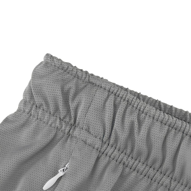 A close-up of grey breathable fabric with an elastic waistband and zipper, featuring a logo.