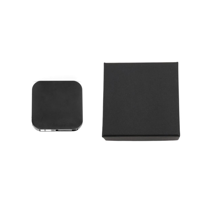 A black retractable charging cable with a phone stand, next to a matching black box for packaging.
