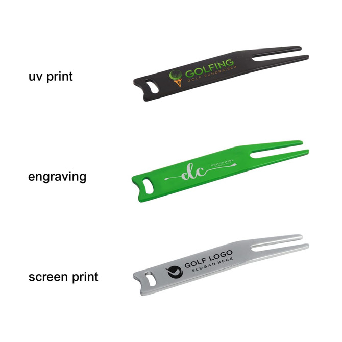 A set of three golf divot tools in black, green, and silver, each featuring a different brand logo or engraving.