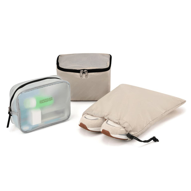 Three organisational bags in beige and translucent materials for storage, featuring a shoe bag, a small pouch, and a zippered bag.