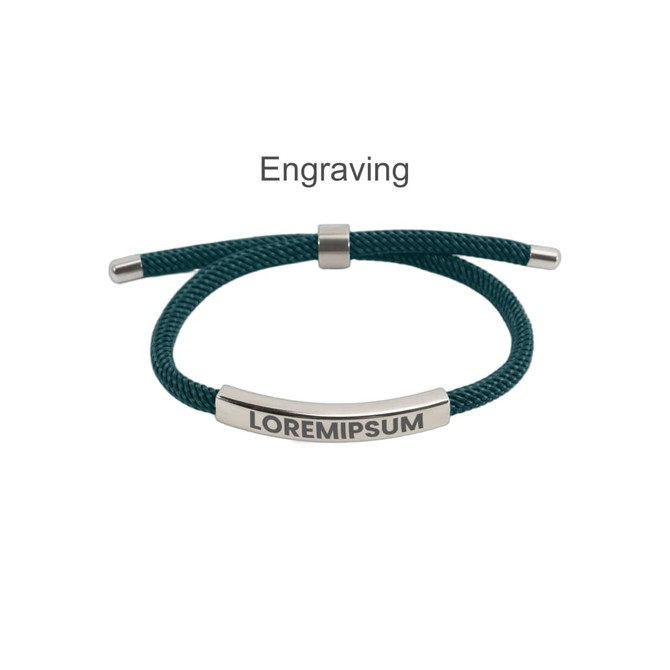 A metal woven bracelet with a teal cord and a silver engraving plate. It features a logo on the plate.