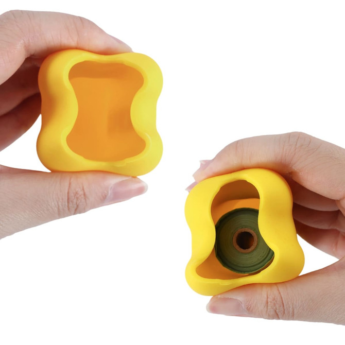 A yellow silicone dog poop bag dispenser shaped like a bone, being held in two hands.