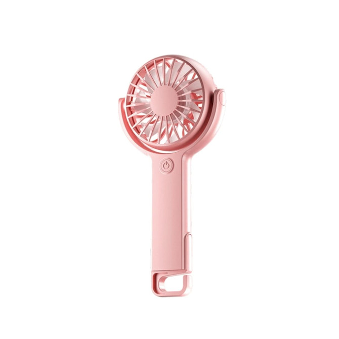 A handheld fan in soft pink with a round grille and adjustable angle. It features a power button and a loop for carrying.
