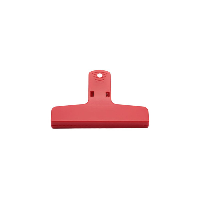 A red plastic magnetic clip with a flat base and a hole for hanging, featuring a simple design.