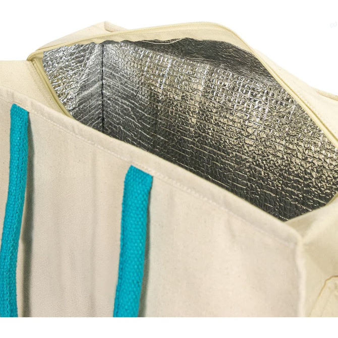 A cooler bag in cream with turquoise straps, featuring a silver insulated interior. It has a logo on the exterior.