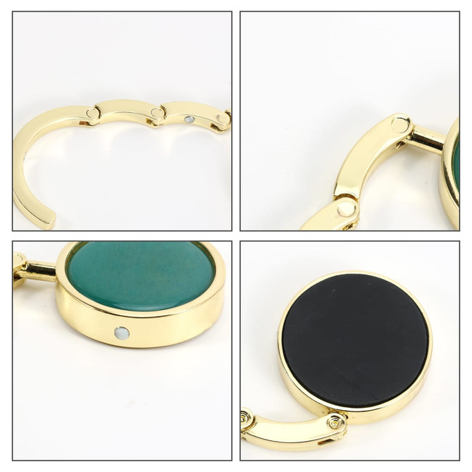 A round foldable desk hook with a green and black surface, featuring a shiny gold frame and a small logo.