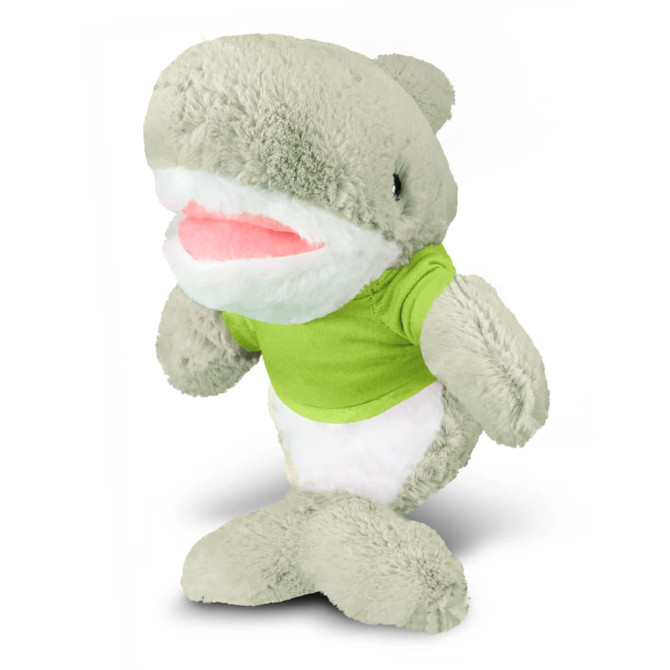 A plush toy shark in grey with a white belly, wearing a green shirt, featuring a logo on the shirt.