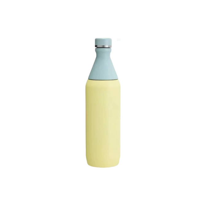 A drink bottle in pastel yellow with a light blue top, featuring a logo. It has a slim, double wall design.