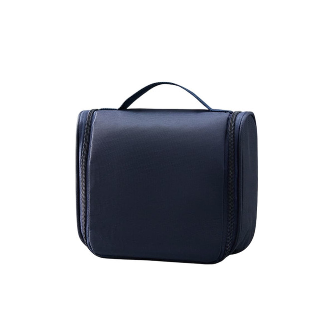A hanging travel toiletry bag in navy blue with a zip closure and a sturdy handle on top.