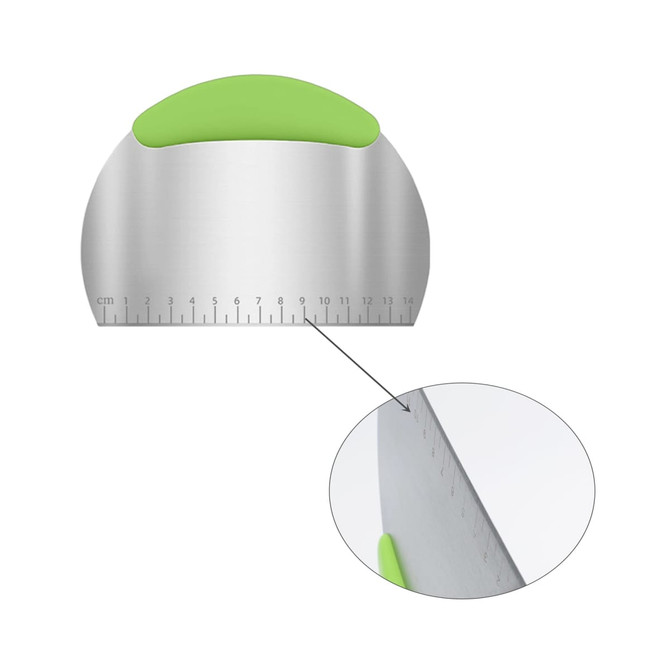 A stainless steel flour cutter with a green silicone handle and measurement markings along the edge.