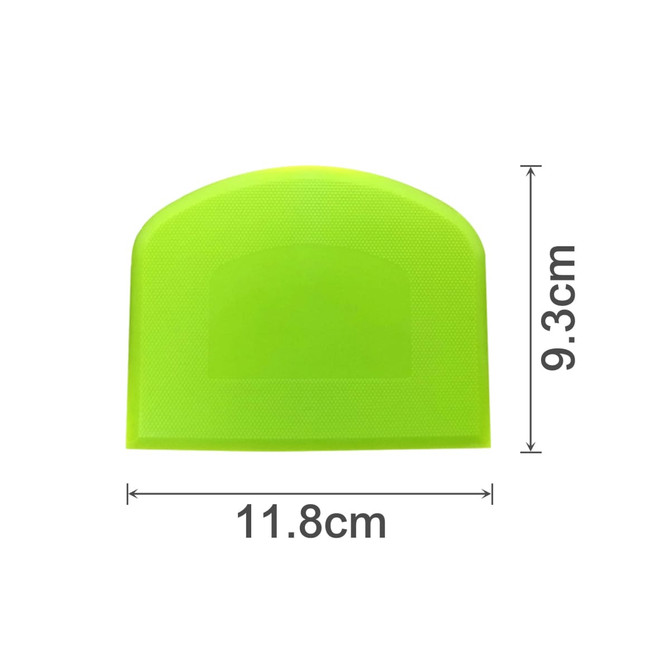 A flexible bowl scraper in bright green, measuring 11.8 cm by 9.3 cm, featuring a textured surface and rounded design.