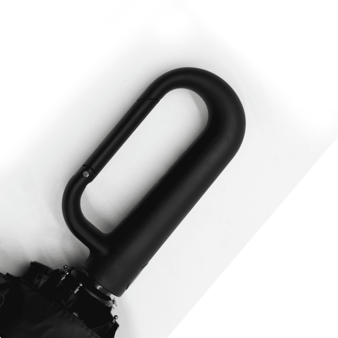 A black foldable umbrella featuring a curved handle and a sleek design. It includes a logo on the handle.