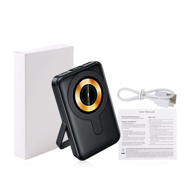 A black 10000mAh magnetic wireless power bank with a gold circle design and a built-in phone stand, accompanied by a charging cable and user manual.