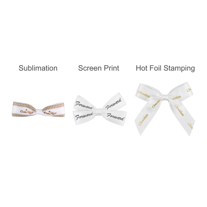 Three hair clip bows in various designs: a brown checkered bow, a white bow with black text, and a glossy white bow with gold lettering.