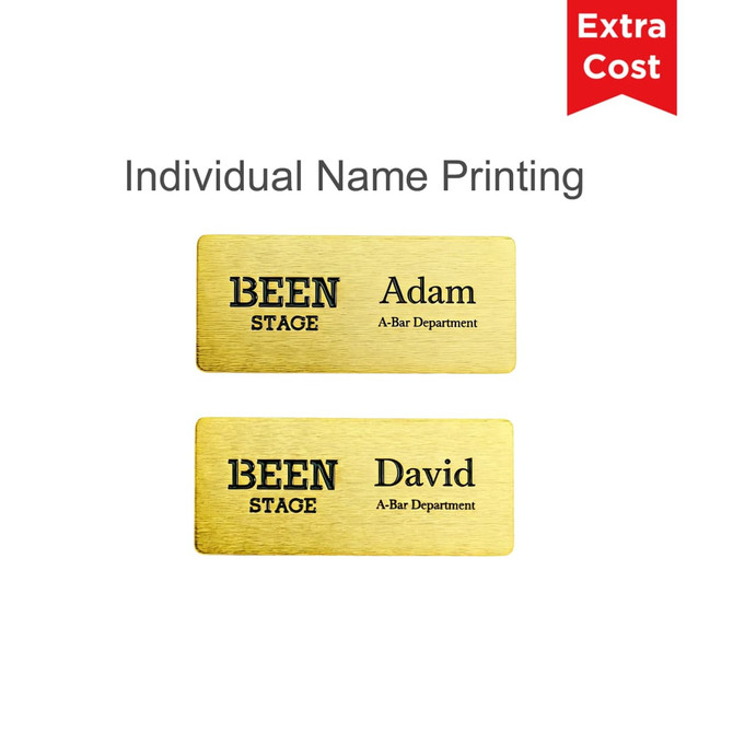 A gold metal name badge featuring two nameplates with black text and a logo. One plate reads "Adam" and the other "David."