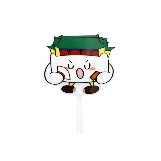 A transparent PVC hand fan featuring a playful character holding items, with a green and red building design.