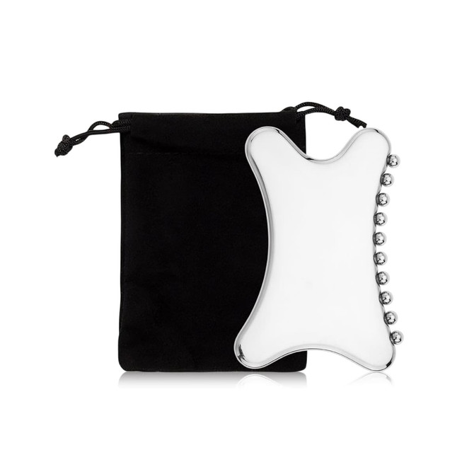 A Gua Sha tool in a clear, curved design beside a black carrying pouch. The tool features rounded edges and silver accents.