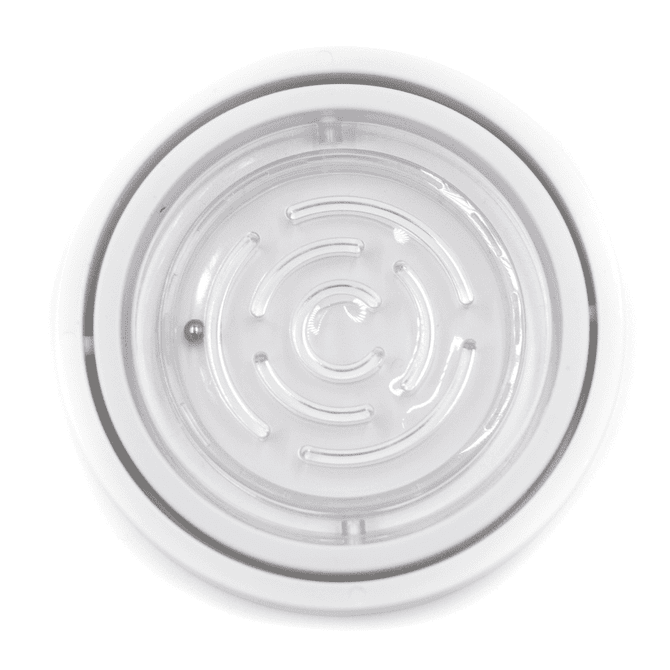 A circular fidget toy in clear plastic featuring a spiral maze design with a small ball inside.