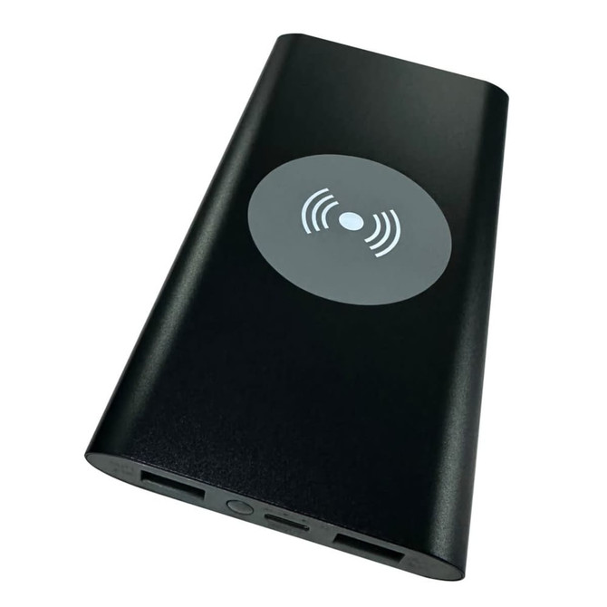A black power bank with a wireless charging symbol and USB ports, featuring a sleek, minimalist design.