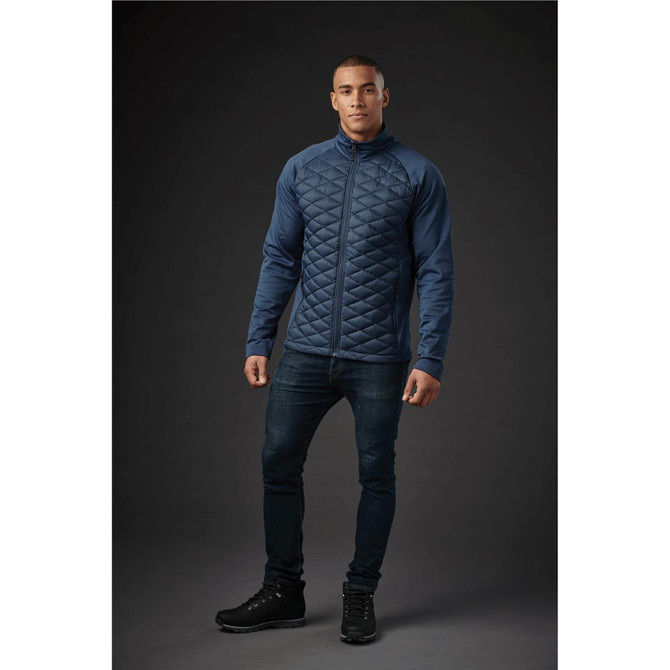 A men's thermal shell jacket in navy, featuring a quilted design and a logo.