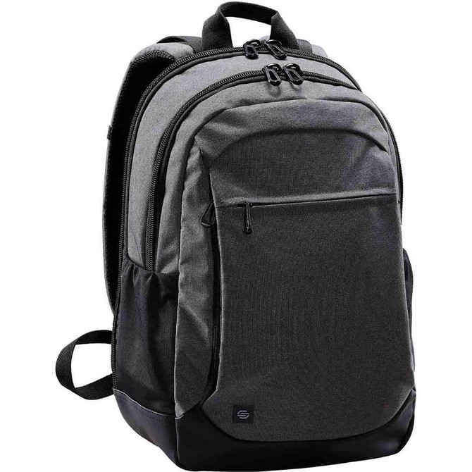 A grey backpack with black detailing, featuring multiple compartments and a logo on the front.