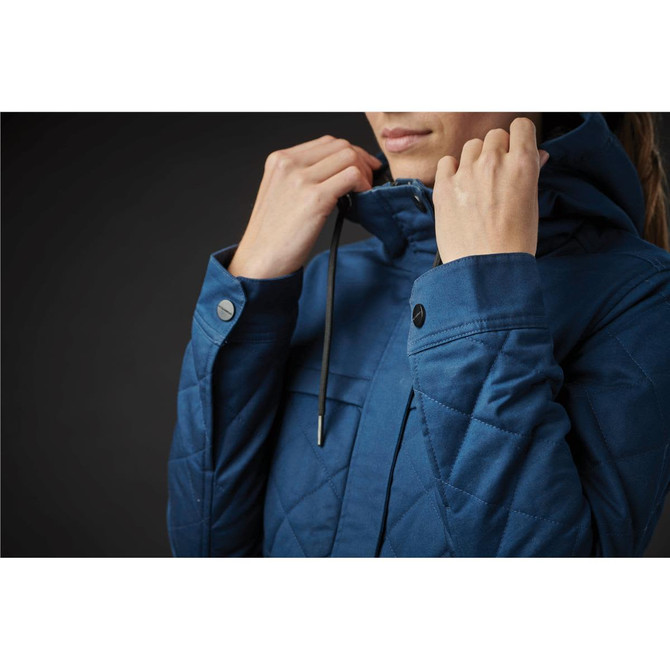 A women's quilted jacket in a deep blue hue, featuring a hood and detailed stitching. It has a brand logo.