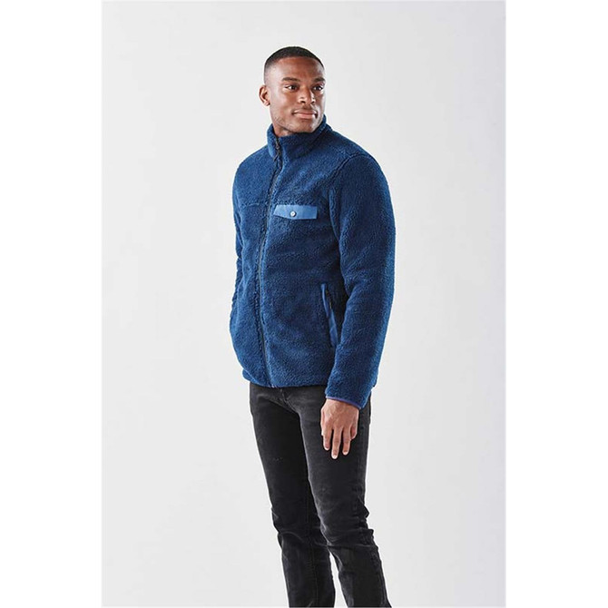 A men's Bergen Sherpa fleece jacket in navy blue with a chest pocket and a logo.