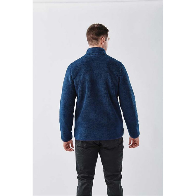 A men's Bergen Sherpa fleece jacket in navy blue, featuring a high collar and a back view. The jacket has a logo.