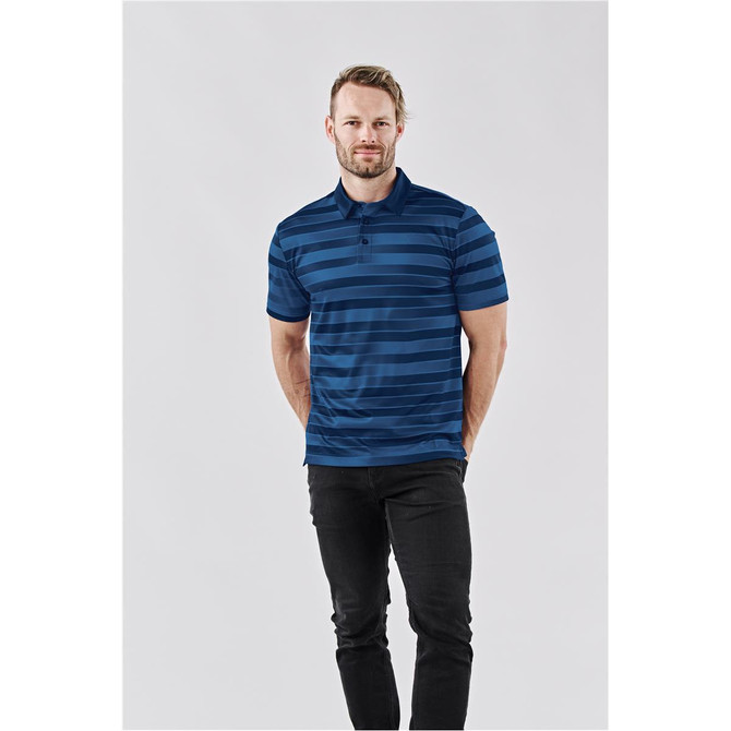 A man wearing a navy blue striped polo shirt, featuring a small collar and a logo. Styled with black pants.