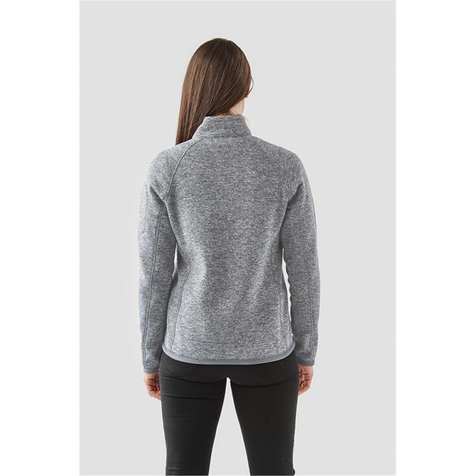 A women's polar fleece jacket in grey, featuring a full zip and a high collar, with a logo on the back.