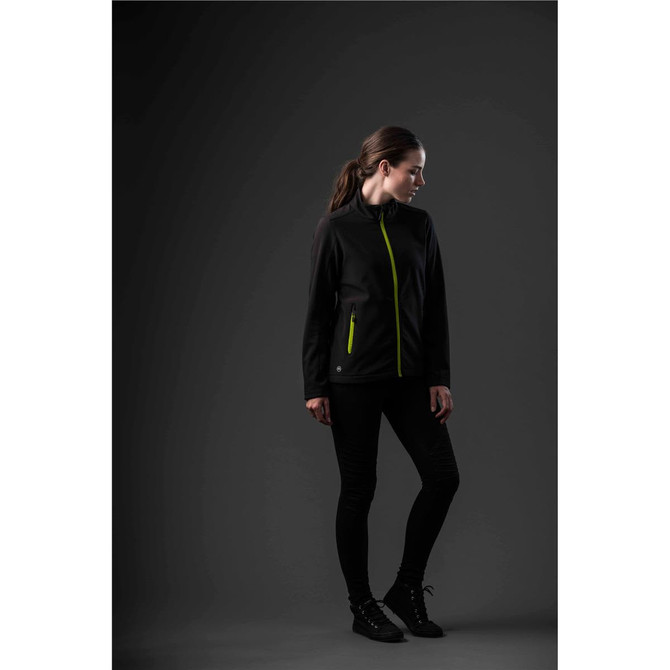 A softshell jacket in black with bright green zippers, featuring a sleek design and a branded logo.