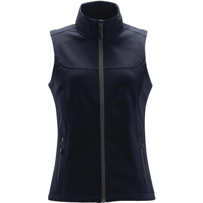 A women's softshell vest in navy blue with a high collar and zippered pockets, featuring branding.
