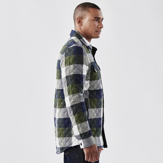 A men's quilted shacket in green, navy, and grey check pattern, featuring a logo on the front.