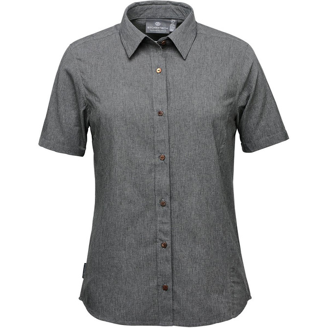 A women's button-up shirt in green with a short sleeve design and brown buttons. It features a logo on the label.
