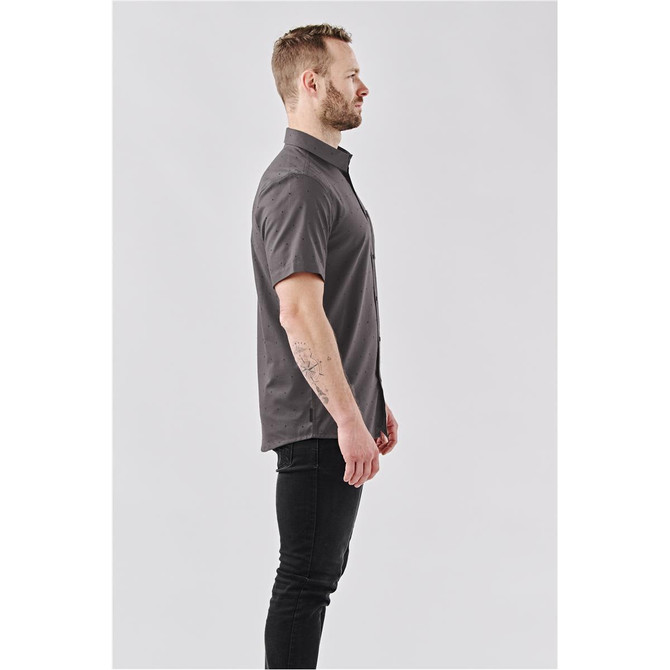 A men's button-up shirt in dark grey, featuring short sleeves and a standard collar, with a subtle logo.