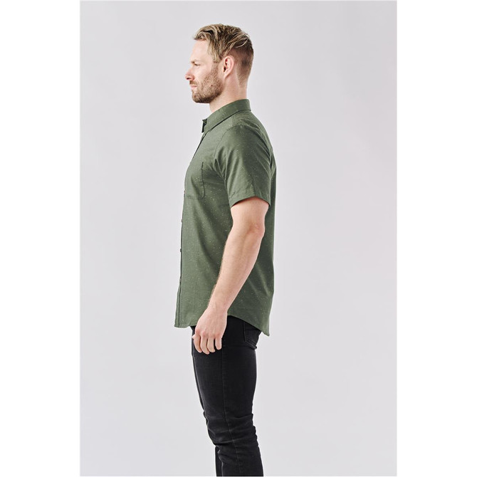 A men's short-sleeve button-up shirt in olive green, displayed on a model from the side.