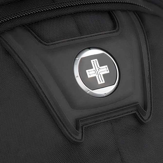A close-up of a black backpack featuring a circular logo on the front panel.