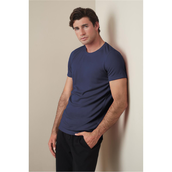 A navy blue crew neck t-shirt for men, featuring a fitted style with short sleeves, paired with black pants.