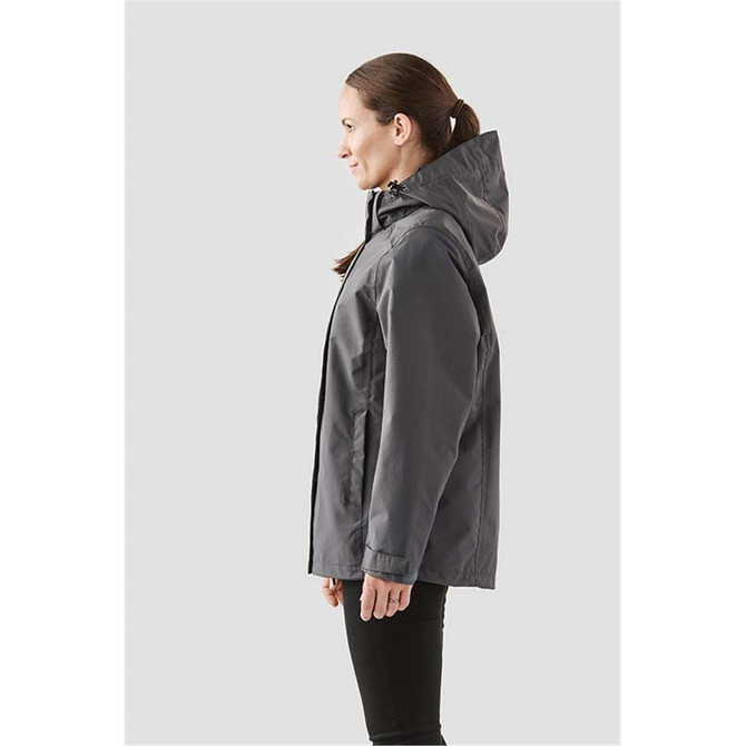 A women's grey Magellan System Jacket with a hood, featuring a branding logo, displayed from the side.