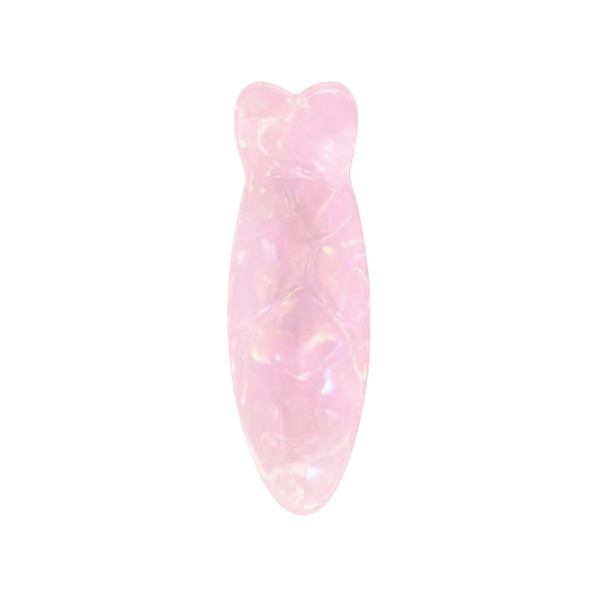 A pink, iridescent hair clip shaped like a fish, featuring a glossy finish and smooth contours.