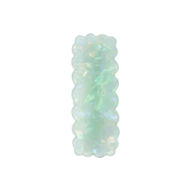An iridescent hair clip in a wavy rectangle shape, featuring shades of pale green and blue. It has a glossy finish.