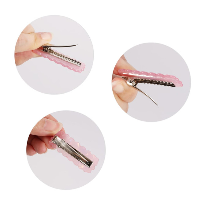 A pink iridescent hair clip with a wavy design and a metal clasp, displayed in three close-up views.