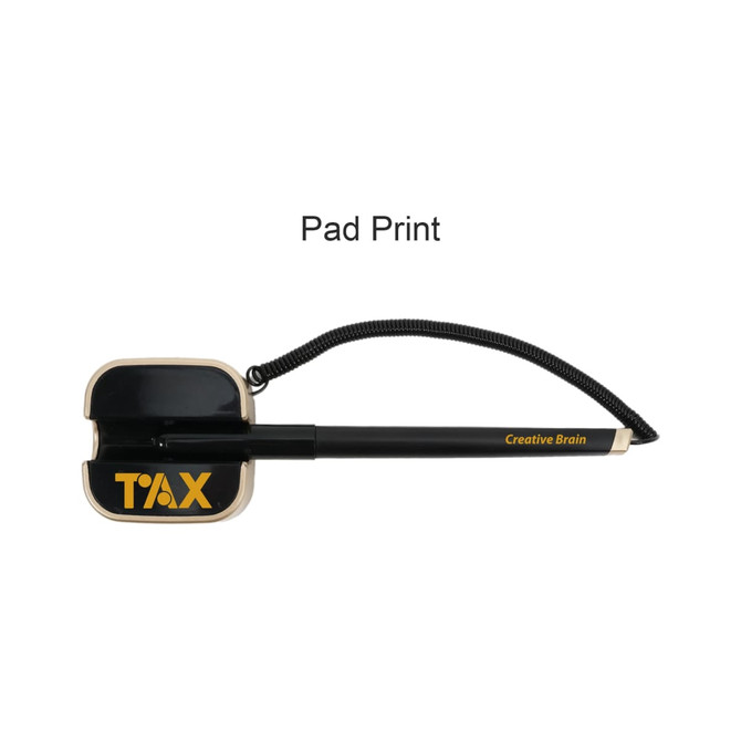 A black and gold pen with a unique square-shaped top and a cord attached. The pen features a logo.