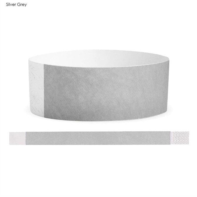 A silver grey Tyvek adult wristband with a smooth texture and integrated branding.