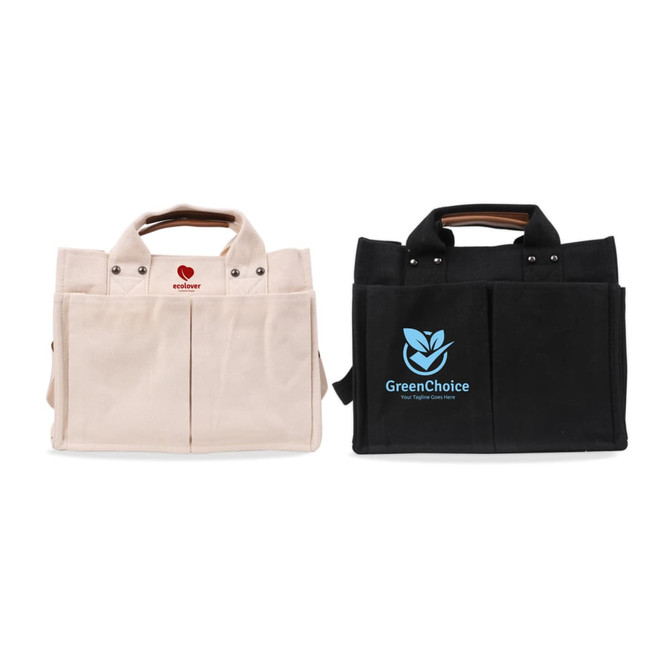 Two canvas tote bags, one in cream and one in black, both with handles and a logo on the black bag.